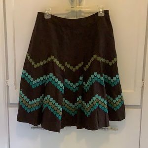 Brown pleated skirt with colorful accents